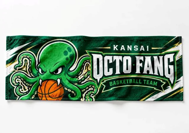 緑を基調にタコのキャラクターとバスケットボールをデザインした、スポーツチーム向けオリジナルフェイスタオル